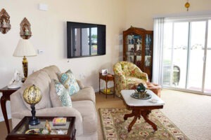 Interior living room with couch, armchair, and coffee table