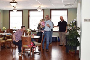 Family gathered around a table in dining area